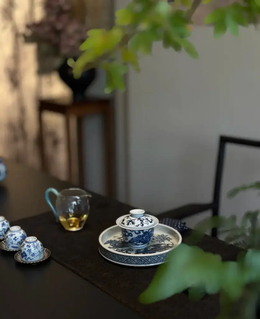 Elegant handmade blue and white porcelain tea set on display, showcasing traditional Chinese ceramic craftsmanship