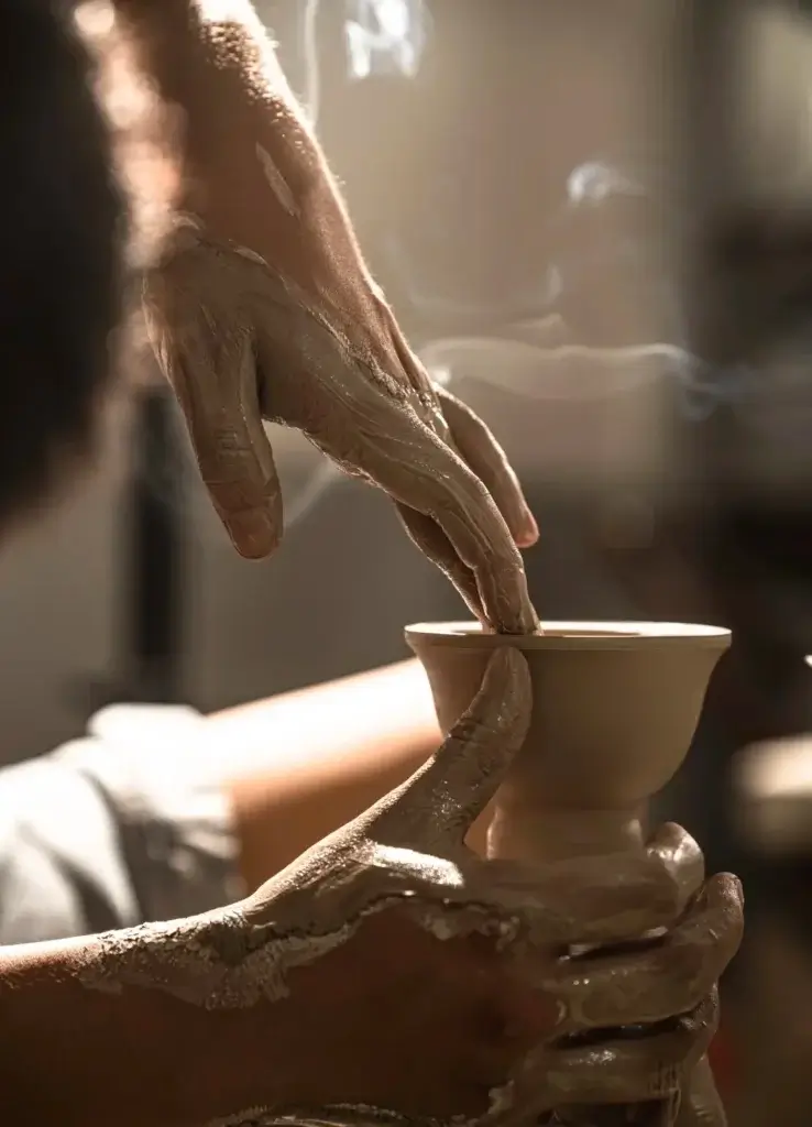 Artisan shaping porcelain, traditional craft