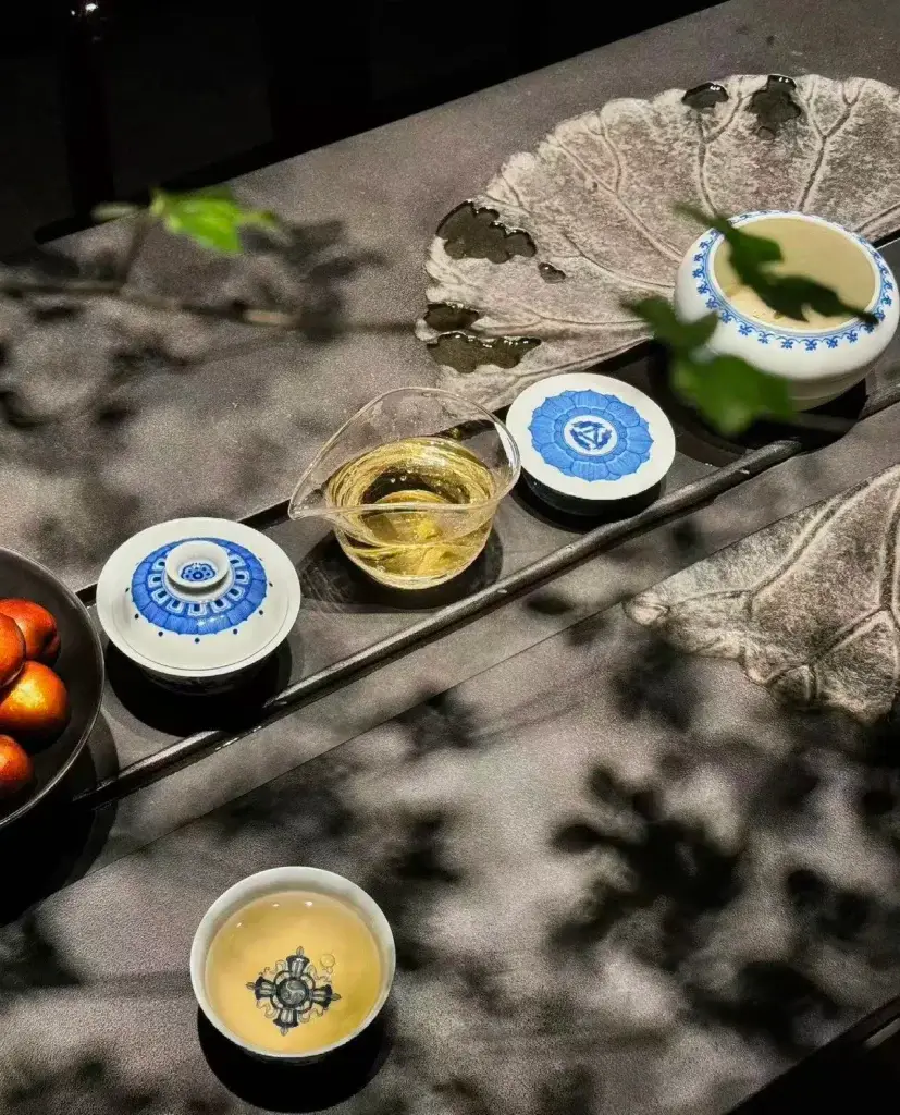 Jingdezhen blue and white tea set displayed on a modern tea table