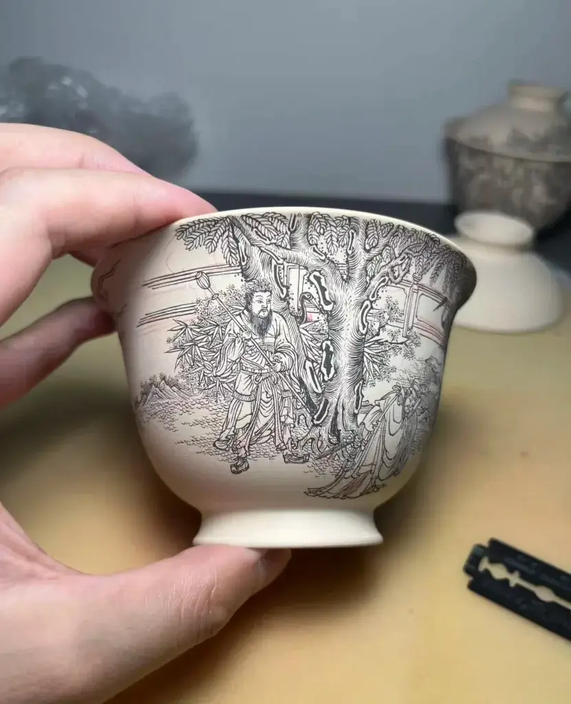 Hand-painted raw porcelain gaiwan showing traditional craftsmanship